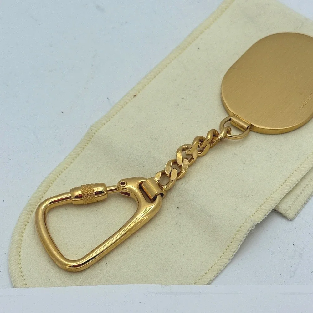 Dunhill Made in Italy Gold-Tone & Black Textured Leather Oval Keychain Key Fob‎